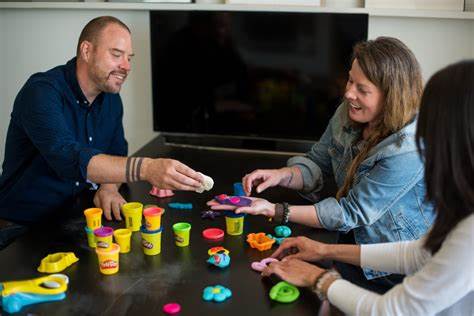 People with playdoh around a table